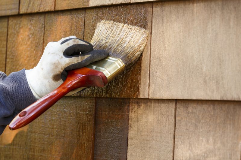 Close-up of Log Siding Stain Application